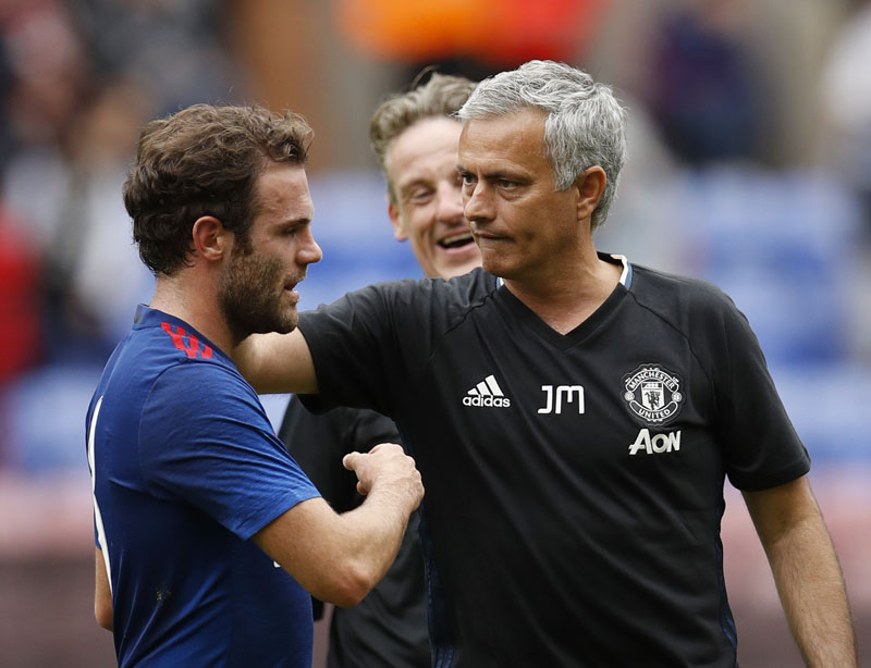 Manchester United manager Jose Mourinho with Juan Mata after the game against Wigan Athletic on July 17, 2016. Photo: Reuters/Filen