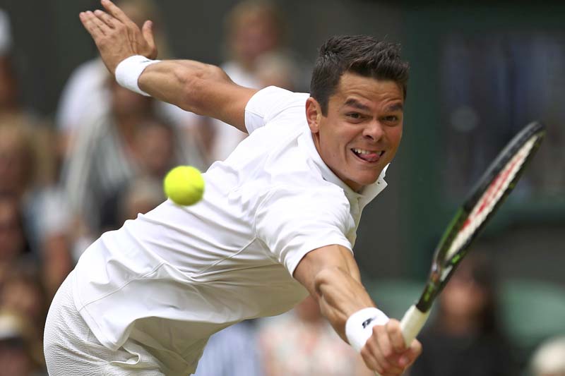 Canada's Milos Raonic returns to Switzerland's Roger Federer during their Wimbledon menu2019s singles semi-final match at the All England Lawn Tennis and Croquet Club in London on Friday, July 8, 2016. Photo: Reuters