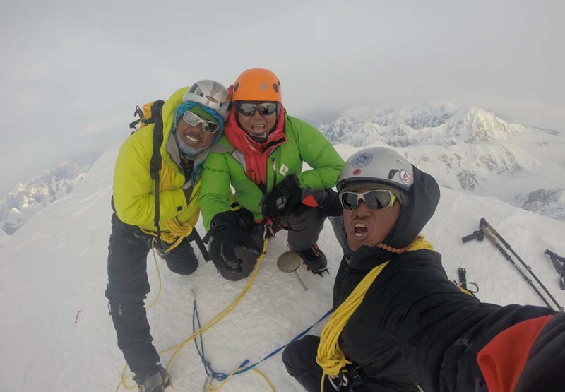 Nima Tenji Sherpa, Tashi Sherpa and Tenzeeng Sherpa take a photograph on the top of Mt Denali (6,190 m), in Atlanta, on June 22, 2016. Photo: Nima Tenji Sherpa