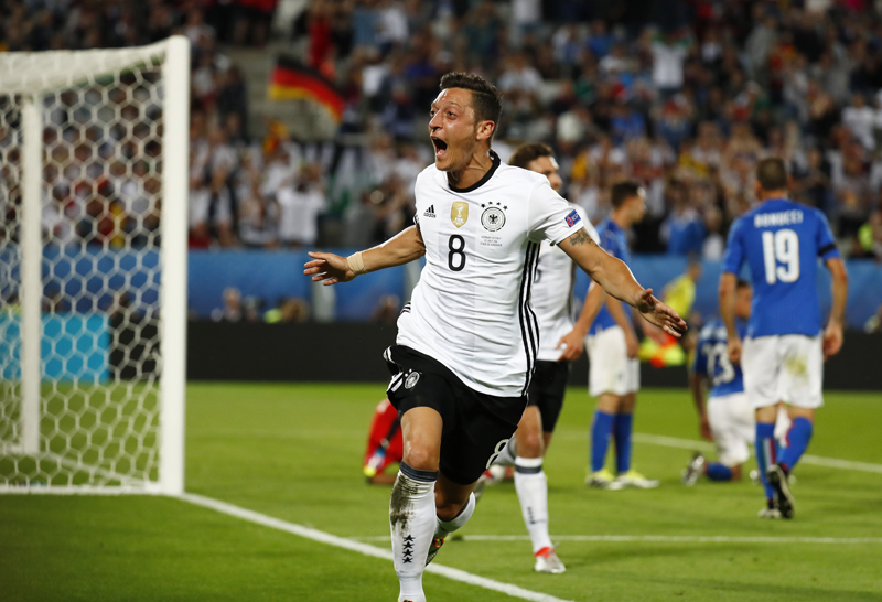 Germany's Mesut Ozil celebrates after scoring their first goal against Italy at Stade de Bordeaux, in France, on Saturday, July 2, 2016. Photo: Reuters