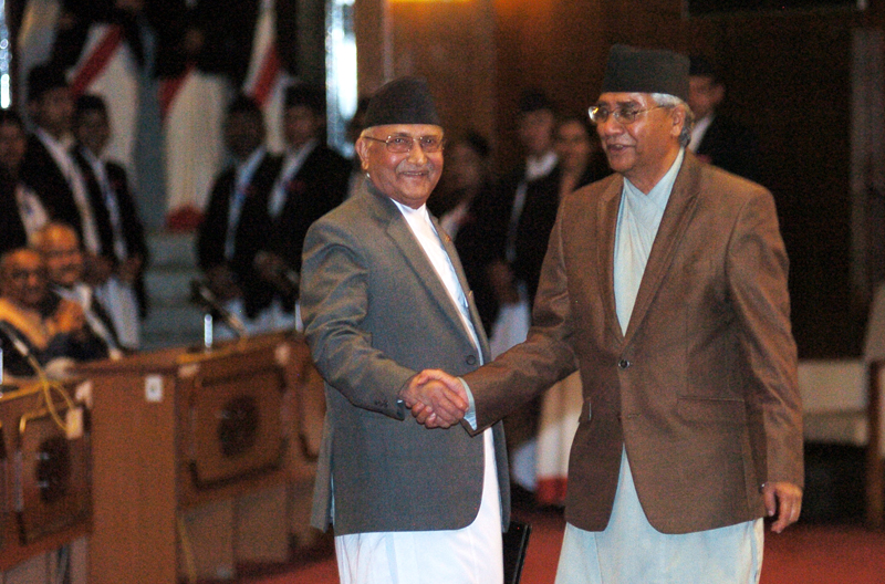 PM KP Sharma Oli shakes hands with Nepali Congress President Sher Bahadur Deuba before announcing his resignation at the Parliament, on Sunday, July 24, 2016. Photo: Dhruba Ale