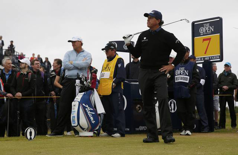 Phil Mickelson of the US watches his tee shot on the seventh hole during the second round as South Africa's Ernie Els looks on - Royal Troon, Scotland, Britain on July 15, 2016. Photo: Reuters