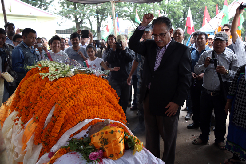 CPN Maoist Centre Chairman Pushpa Kamal Dahal pays final tribute to former minsiter Mangal Siddhi Manandhar, who died on Friday, in Kathmandu, on Saturday, July 2, 2016. Photo: RSS