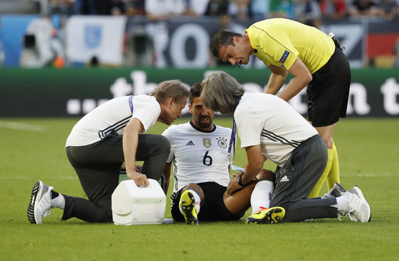 Germany's Sami Khedira lies injured and receives medical treatment during Germany's quarter-final clash with Italy at Stade de Bordeaux on July 2, 2016. Photo: Reuters/Filenn