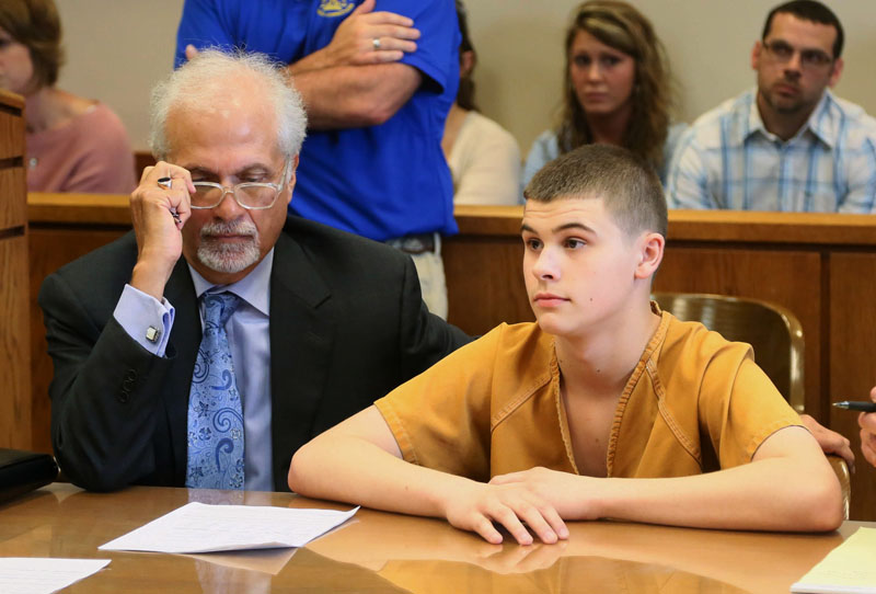 FILE - James Austin Hancock, a teen charged in a school cafeteria shooting that took place February 29, 2016, sits next to his attorney Charlie Rittgers Sr. before Judge Ronald Craft in Butler County Juvenile Court in Hamilton, Ohio, on April 28, 2016.  Photo: Greg Lynch/Journal-News via AP