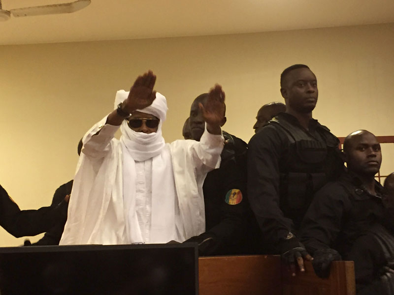 Chad's former dictator Hissene Habre raises his hands after sentencing during court proceedings in Dakar, Senegal, on Friday, July 29, 2016. Photo : AP