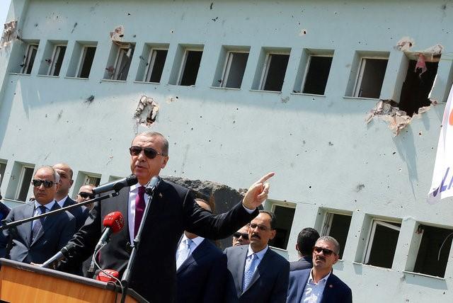Turkey's President Tayyip Erdogan addresses the audience as he visits the Turkish police special forces base damaged by fighting during a coup attempt in Ankara, Turkey, July 29, 2016. Kayhan Ozer/Courtesy of Presidential Palace/Handout via REUTERS