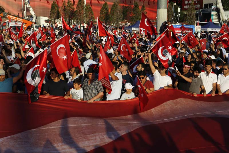 Supporters of the Republican People's Party, or CHP, wave Turkish flags during a 'Republic and Democracy Rally' at Taksim square in central Istanbu on Sunday, July 24, 2016. Photo: AP
