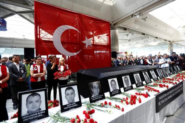 Airport employees attend a ceremony for their friends, who were killed in Tuesday's attack at the airport, at the international departure terminal of Ataturk airport in Istanbul, Turkey, June 30, 2016. REUTERS/Murad Sezer