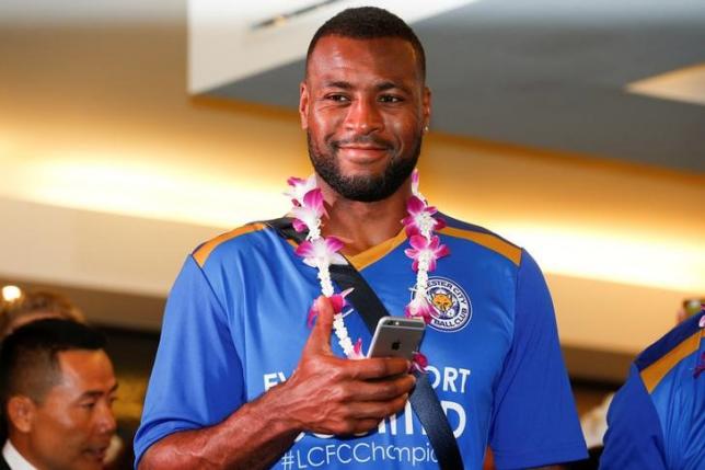 Leicester City's player Wes Morgan gestures as he arrives with his team at Suvarnabhumi International Airport, in Bangkok, Thailand, May 18, 2016. REUTERS/Athit Perawongmetha/Files