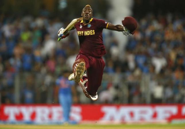 Cricket - West Indies v India - World Twenty20 cricket tournament semi-final - Mumbai, India - 31/03/2016. West Indies Andre Russell celebrates after winning their match.   REUTERS/Danish Siddiqui