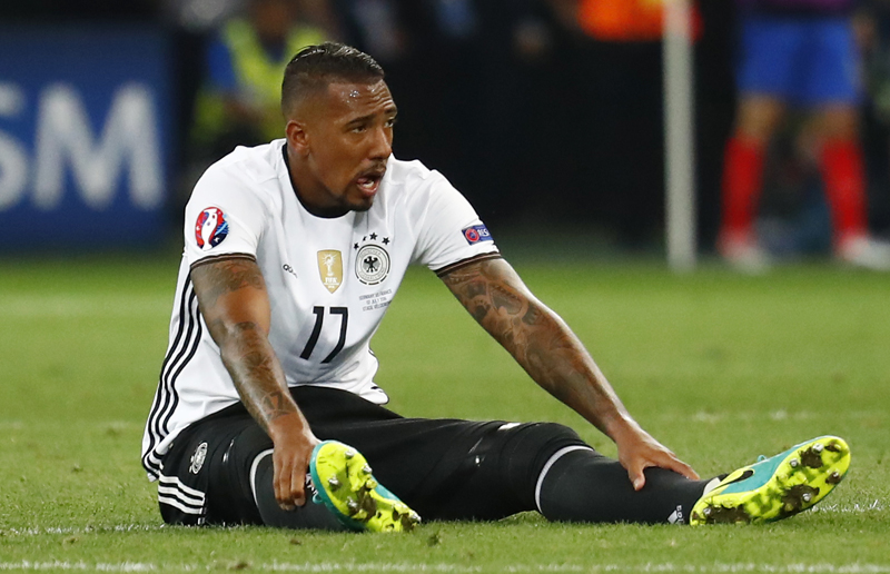 Germany's Jerome Boateng is down after sustaining a injuryn. Photo: Reuters
