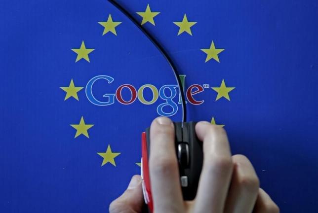 A woman hovers a mouse over the Google and European Union logos in this April 15, 2015 photo illustration.  REUTERS/Dado Ruvic/Illustration/File Photo