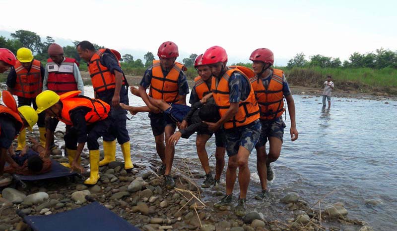 FILE: A rescue drill organised by the District Natural Disaster Rescue Committee, where security personnel are seen actively participating, near flooded Chaudhar Khola, Bedkot Municipality-4, Kanchanpur, on Sunday, July 31, 2016. Photo: RSS