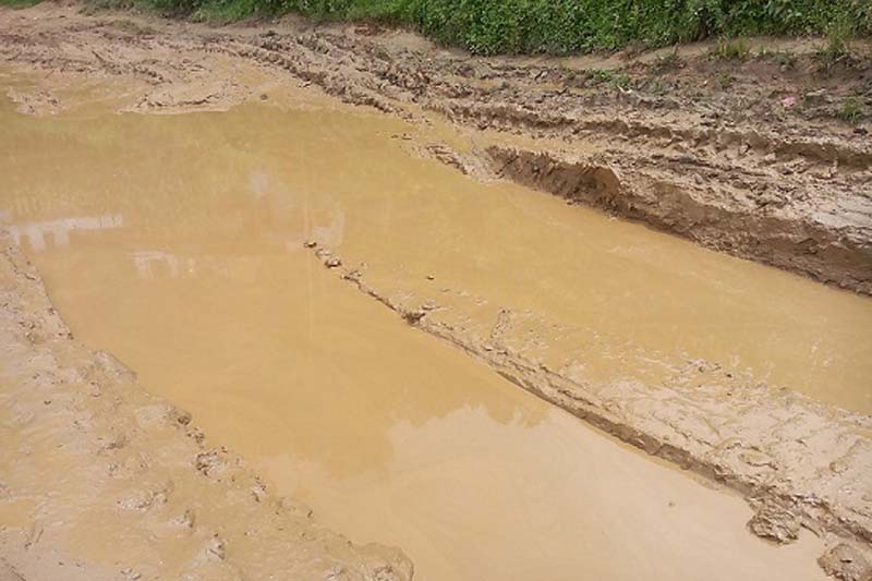 A muddy road near Sanibare Hatiya of Bhojpur Municipality on Monday, July 11, 2016. The road often gets muddy during the monsoon season due to negligence of authorities. Photo: Niroj Koirala