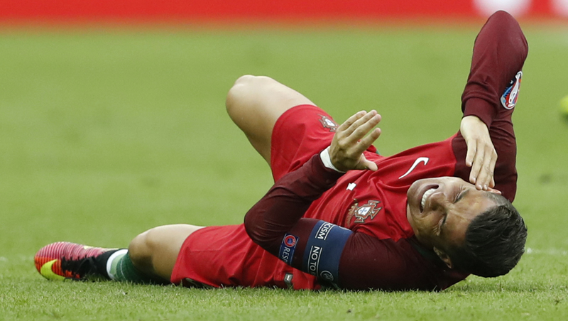 Portugal's Cristiano Ronaldo sustains an injury during Euro 2016 Final against hosts France at Stade de France in Paris, on Sunday, July 10, 2016. Photo: Reuters