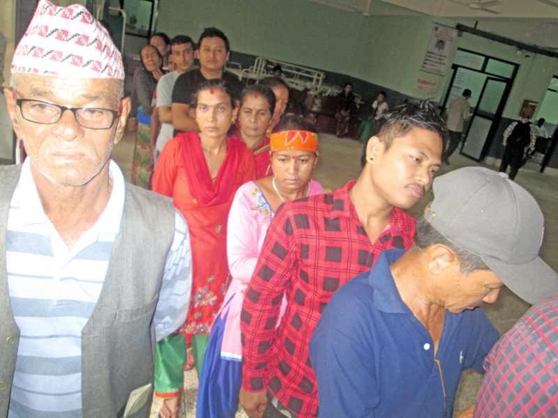 Patients suffering from viral fever and typhoid lining up for health check-up in Damauli Hospital, nTanahun, on Thursday, July 28, 2016. Photo: THT