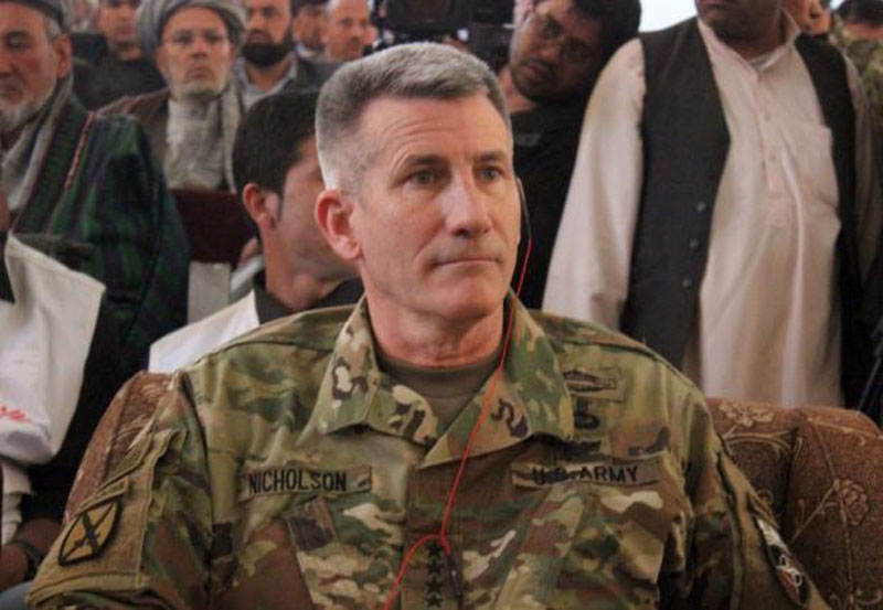 The commander of U.S. and NATO forces in Afghanistan General John W. Nicholson sits during his visits from Kunduz province, Afghanistan, March 22, 2016. Photo: Reuters