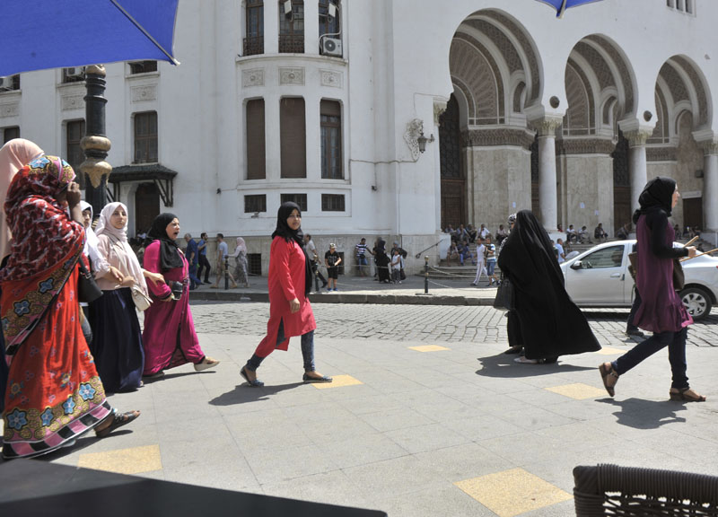 A veiled woman walks in central Algiers, on Wednesday August 10, 2016. Photo: AP