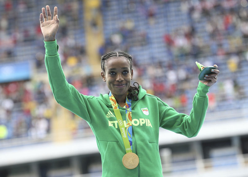 File - Gold medallist Almaz Ayana of Ethiopia poses with her medal after winning Women's 10,000m at 2016 Rio Olympics in Rio de Janeiro, Brazil, on August 12, 2016.