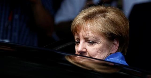 German Chancellor Angela Merkel leaves a news conference in Berlin, Germany, July 28, 2016. REUTERS/Hannibal Hanschke/Files