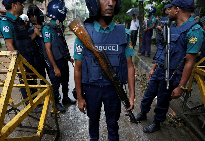 File- Policemen stand guard along a road leading to the Holey Artisan Bakery and the O'Kitchen Restaurant after gunmen attacked, in Dhaka, Bangladesh, July 3, 2016. Photo: REUTERS