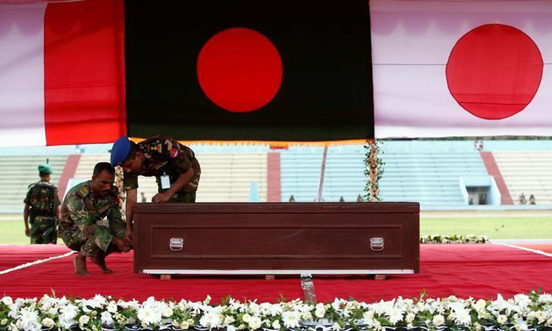 Army personnel adjust a coffin of a victim who was killed in the attack on the Holey Artisan Bakery and the O'Kitchen Restaurant, during a memorial ceremony in Dhaka, Bangladesh, on July 4, 2016. Photo: Reuters