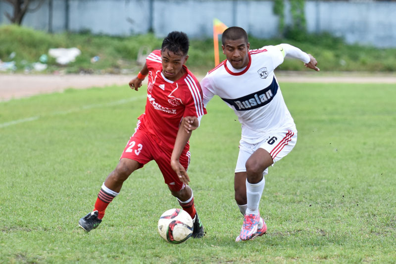 Players of Bansbari Club and Khumaltar Youth Club (right) vie for the ball during their Martyrs Memorial B Division League match in Kathmandu on Sunday, August 28, 2016. Photo: THT