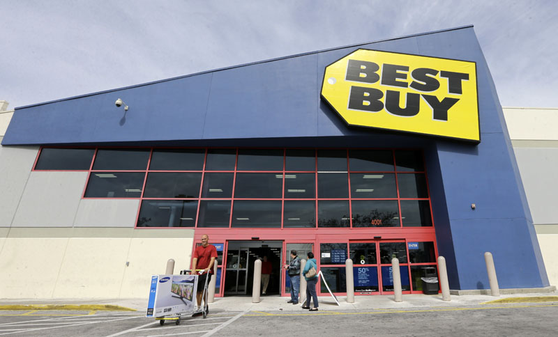 FILE - A shopper carts his purchased LED TV at a Best Buy in Miami, on Tuesday, February 9, 2016. Photo: AP