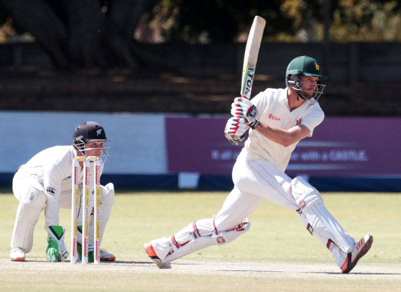 Zimbabwe's batsman Craig Ervine (R) plays a shot during the third day of the second test in a series of two matches, where New Zealand lead hosts Zimbabwe 1-0, at the Queens Sports Club in Bulawayo on August 8, 2016. Photo: AFP