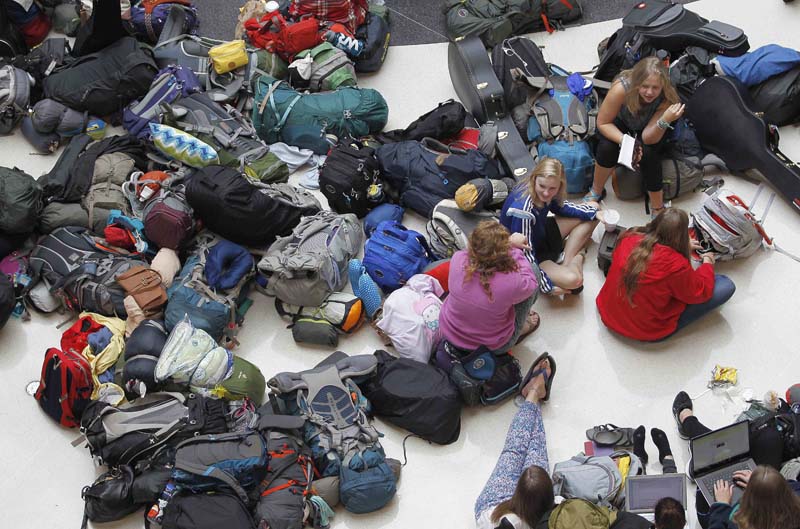 Members of the mission group Adventures In Missions wait to find out if their flight to Guatemala is on time or cancelled, at Hartsfield Jackson Atlanta International Airport in Atlanta, Georgia, US on Monday, August 8, 2016. Photo: Reuters/Tami Chappell