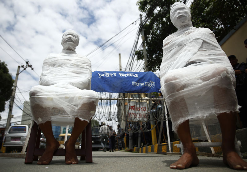    A team of contemporary artists of ArTree Nepal demonstrates in support of Professor Dr Govinda KC against corrupt officials and medical mafias, outside the Prime Minister's residence in Baluwatar, Kathmandu on Saturday, August 20, 2016. Photo: Skanda Gautam