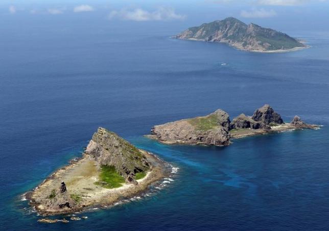 A group of disputed islands, Uotsuri island (top), Minamikojima (bottom) and Kitakojima, known as Senkaku in Japan and Diaoyu in China is seen in the East China Sea, in this photo taken by Kyodo September 2012.  REUTERS/Kyodo/File Photo