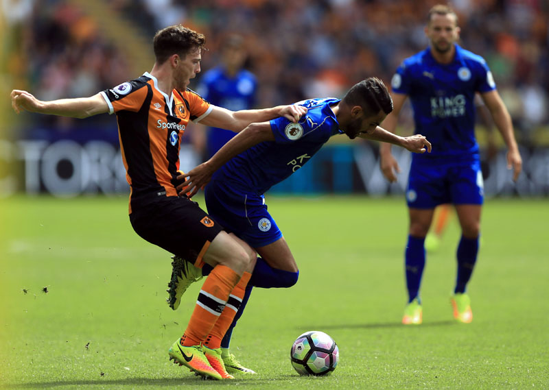 Hull City's Andrew Robertson (left) and Leicester City's Riyad Mahrez in action during their English Premier League soccer match at the KCOM Stadium, Hull, England, on Saturday Aug. 13, 2016. Photo: Nigel French / PA via AP