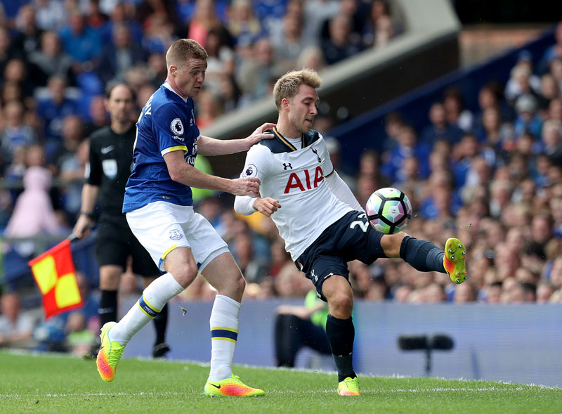 Everton's James McCathy (left) and Tottenham Hotspur's Christian Eriksen (right) in action during their English Premier League soccer match at Goodison Park, Liverpool, England, on Saturday, August 13, 2016. Photo: Peter Byrne/PA via AP