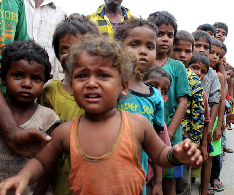 Children affected by floods stand in queue waiting for the relief in Pathari, Diania-3 of Morang on Tuesday, August 02, 2016. Photo: RSS