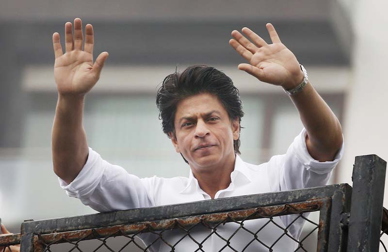 File- Bollywood actor Shah Rukh Khan greets fans waiting outside his residence on Eid al-Fitr in Mumbai, India, on July 7, 2016. Photo: AP