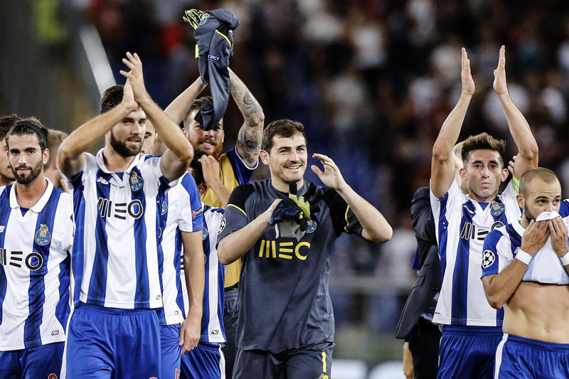 Porto's players celebrate their 3-0 win over Roma, at the end of a Champions League, play-off, return-leg soccer match, at the Rome Olympic stadium, on Tuesday, August 23, 2016. Photo: Angelo CarconiANSA via AP