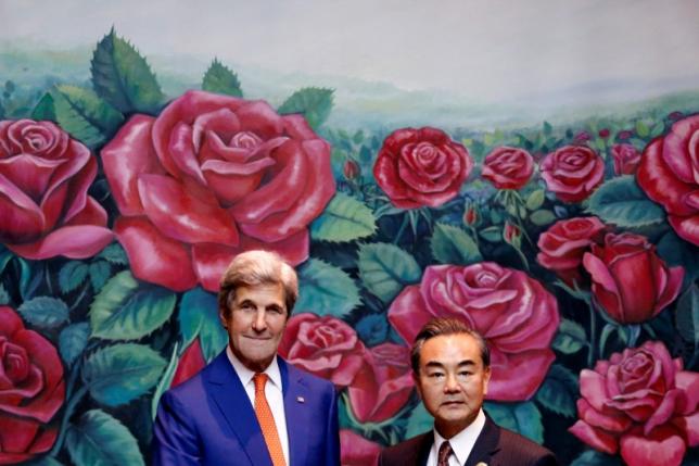 U.S. Secretary of State John Kerry (L) greets China's Foreign Minister Wang Yi during a bilateral meeting at the sidelines of the ASEAN foreign ministers meeting in Vientiane, Laos July 25, 2016. REUTERS/Jorge Silva