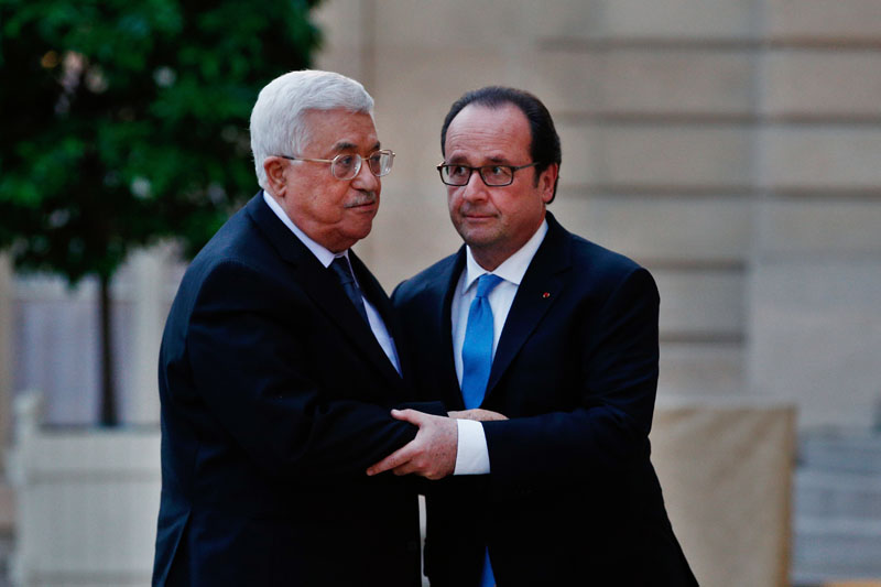 FILE -- In this July 21, 2016 file photo, France's President Francois Hollande, right, greets Palestinian President Mahmoud Abbas, prior to a meeting at the Elysee Palace, in Paris. Photo: AP