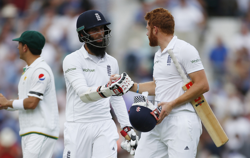 England's Moeen Ali and Jonny Bairstow walk off for tea during Fourth and final test match against Pakistan, at the Oval, on Thursday, August 11, 2016. Photo: Reuters