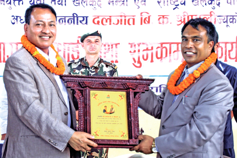 Newly-appointed Minister for Youth and Sports Daljit Sripali receiving a letter of felicitation from National Sports Council Member Secretary Keshab Kumar Bista during a programme in Kathmandu on Tuesday, August 16, 2016. Photo: THT