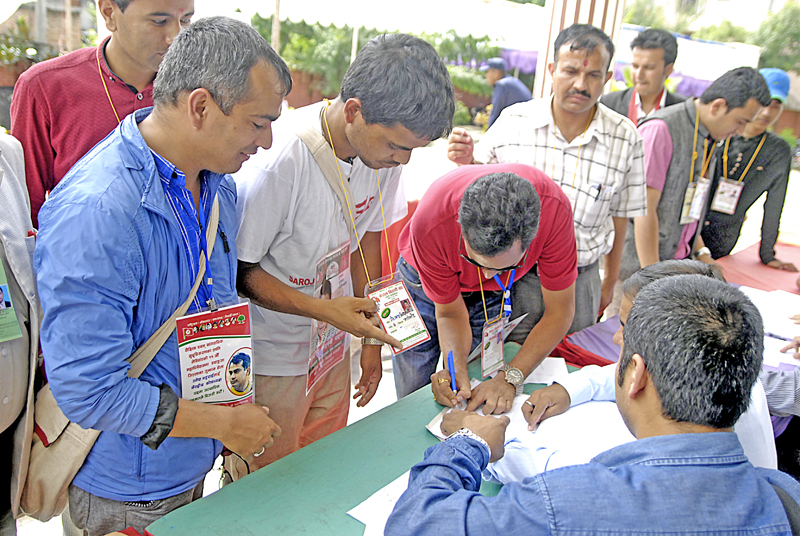 Voters checking their names on the voter list to cast their votes during the national general convention of Nepal Student Union, in Sanepa, Lalitpur, on Wednesday.