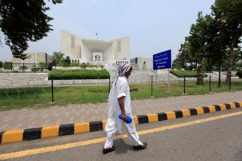 A man walks past the Supreme Court building in Islamabad, Pakistan, June 27, 2016. REUTERS/Faisal Mahmood /Files