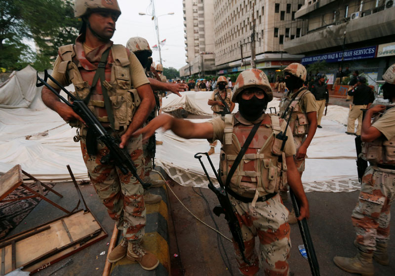 Paramilitary soldiers stand guard near the dismantled makeshift tents of the supporters of Muttahida Qaumi Movement (MQM) political party after a protest, in Karachi, Pakistan, on August 22, 2016. Photo: Reuters
