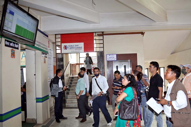 People gathered at the Global IME Capital Limited of Jamal to trade shares, after the Nepal Stock Exchange (Nepse) index surged five per cent yesterday, on Wednesday, August 10, 2016. Photo: RSS