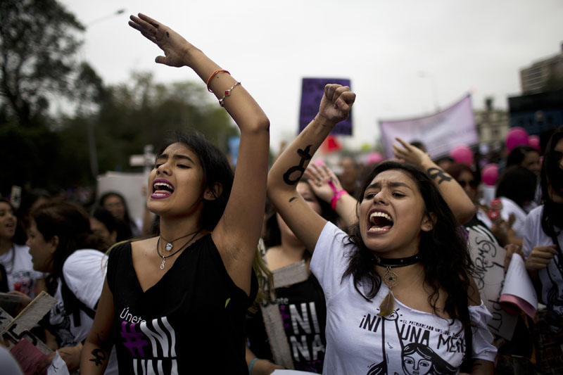 Women chant slogans against the justice system during a march against domestic violence in Lima, Peru, on Saturday, August 13, 2016. Photo: AP