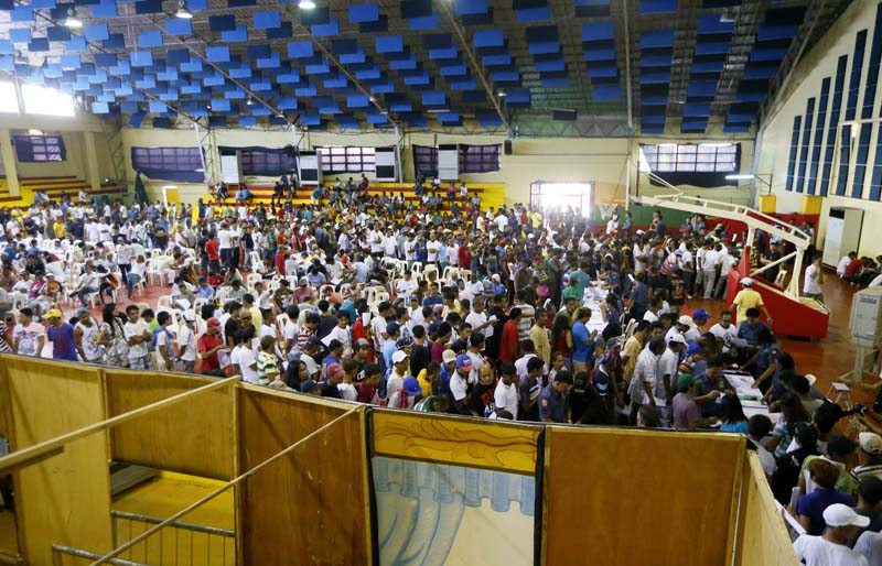 File- More than 1,000 residents queue up in a gymnasium after heeding a call from Tanauan city government to undergo processing allegedly for being drug-users at Tanauan city, Batangas province, south of Manila, on July 18, 2016. Photo: AP