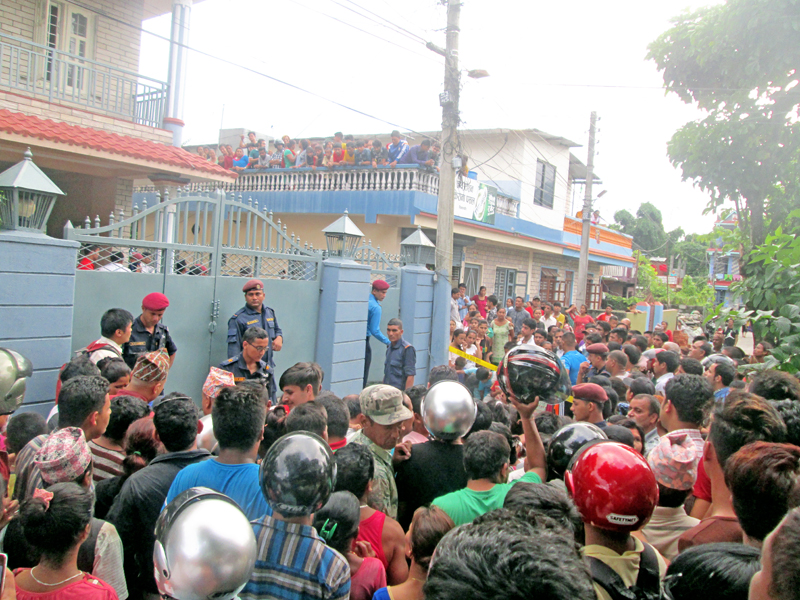 Locals gather outside the house where a man killed his wife before killings himself in Simalchaur of Pokhara, on Wednesday, August 17, 2016. Photo: Rishi Ram Rimal