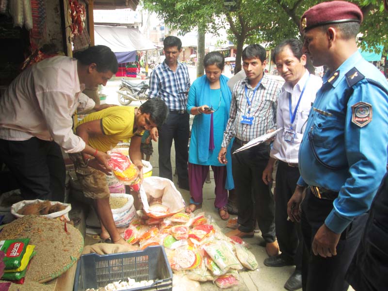 A monitoring team led by officials from the Department Of Supply Management and Protection Of Consumers Interest inspects one of the grocery stores in Damauli of Tanahun district on Wednesday, August 3, 2016. Photo: Madan Wagle
